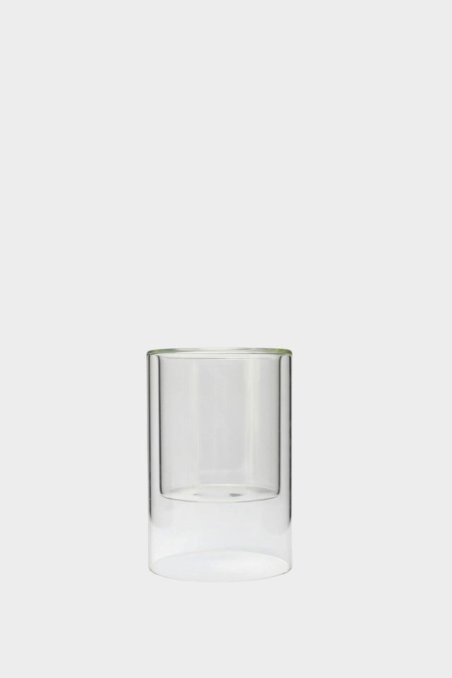 Clear glass tumbler on a white background