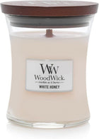 WoodWick White Honey candle with a wooden lid on a white background