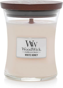 WoodWick White Honey candle with a wooden lid on a white background
