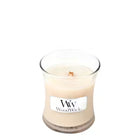 WoodWick candle in a clear glass jar on a white background